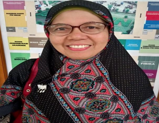 Dr. Hj. Ermi Sola, M.Pd.